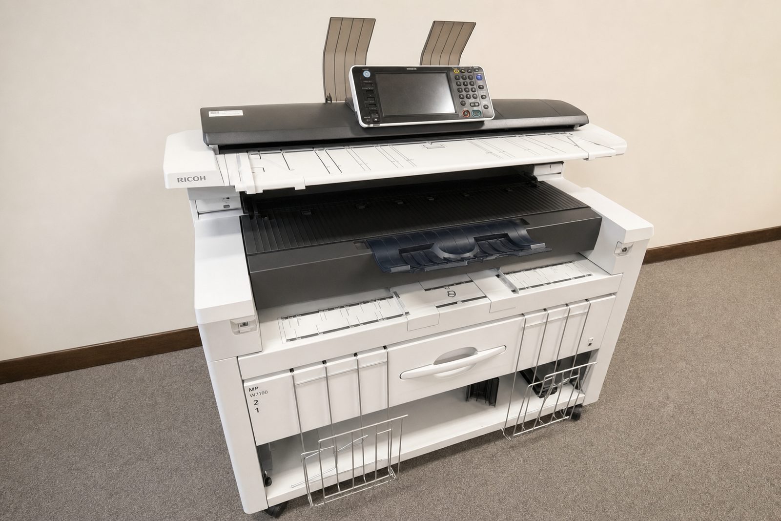 The shop's Ricoh wide-format plan printer and scanner